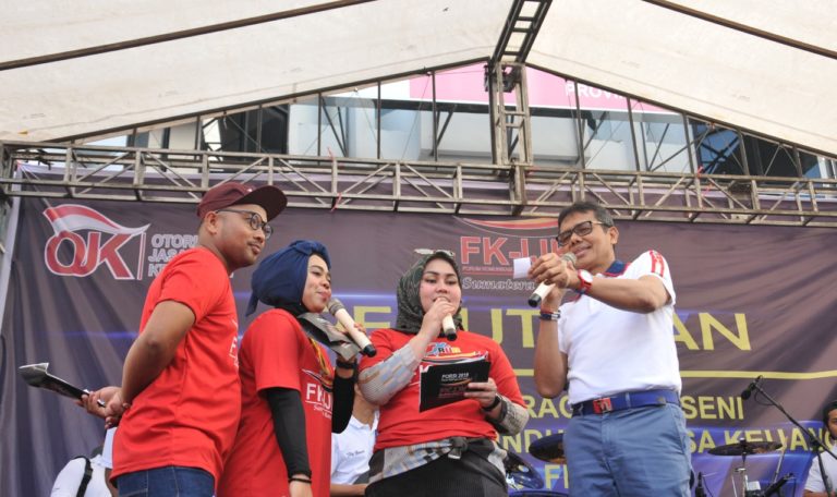 HUT OJK ke 8, IP Band Hibur Masyarakat Kota Padang